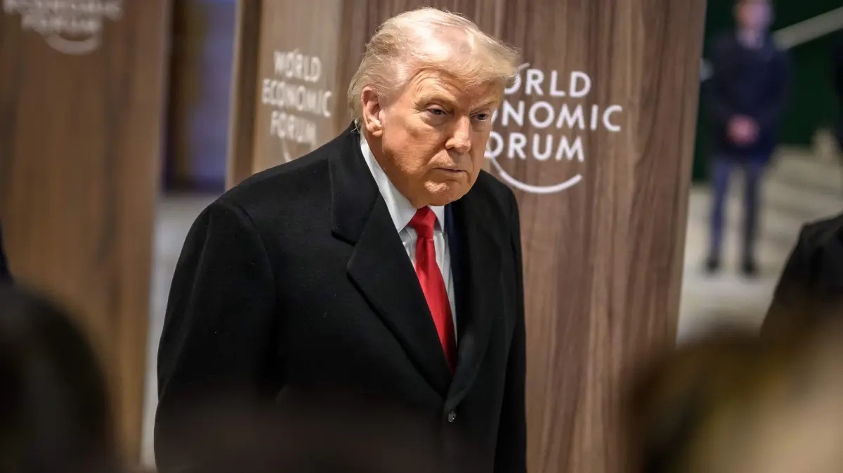 US President Donald Trump addresses the media as he leaves the congress centre during the World Economic Forum (WEF) annual meeting in Davos on January 21, 2026. The World Economic Forum takes place in Davos from January 19 to January 23, 2026. (Photo by Fabrice COFFRINI / AFP)