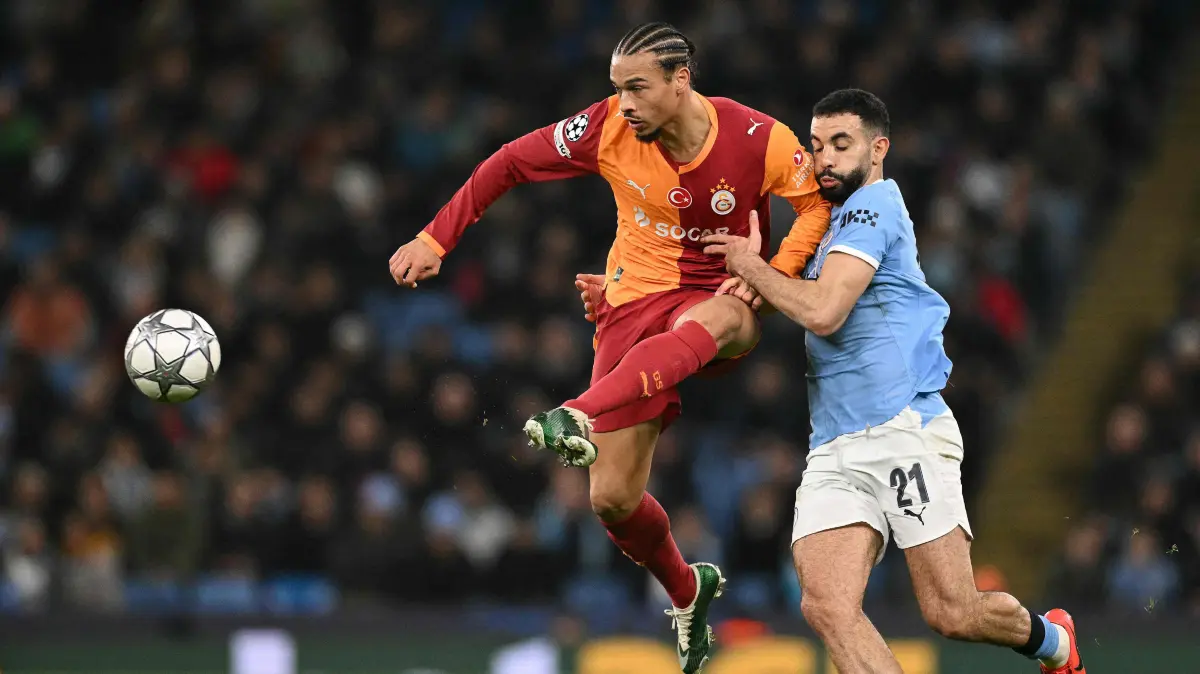 Manchester City's Allgerian defender #21 Rayan Ait-Nouri (R) vies with Galatasaray's German midfielder #10 Leroy Sane during the UEFA Champions League football match between Manchester City and Galatasaray at the Etihad Stadium in Manchester, north west England, on January 28, 2026. (Photo by Oli SCARFF / AFP)