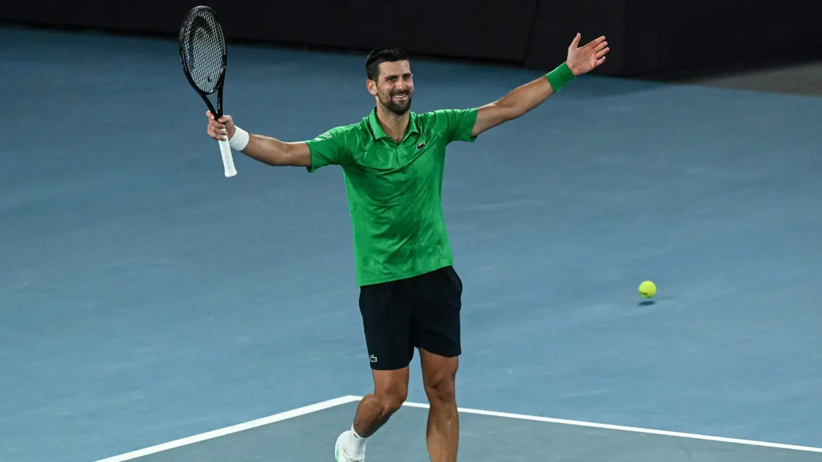 Serbia's Novak Djokovic celebrates victory over Italy's Jannik Sinner after their men's singles semi-final match on day thirteen of the Australian Open tennis tournament in Melbourne on January 31, 2026. (Photo by WILLIAM WEST / AFP) / -- IMAGE RESTRICTED TO EDITORIAL USE - STRICTLY NO COMMERCIAL USE --