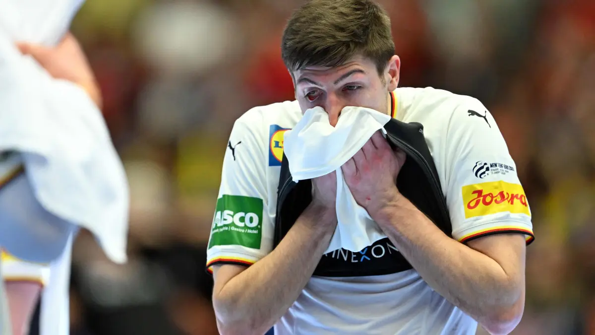 Germany's right winger #17 Lukas Zerbe reacts after the Men's EHF Euro 2026 final handball match Denmark vs Germany in Herning, Denmark, on February 1, 2026. Denmark won the match 34-27. (Photo by Jonathan Nackstrand / AFP)