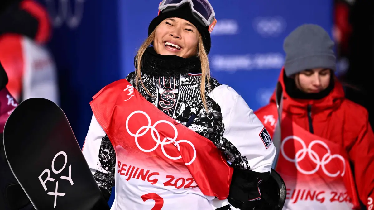 (FILES) USA's Chloe Kim celebrates as she wins the snowboard women's halfpipe final run during the Beijing 2022 Winter Olympic Games at the Genting Snow Park H & S Stadium in Zhangjiakou on February 10, 2022. Chloe Kim arrives at the Milan-Cortina Winter Olympics on the brink of a historic third straight women's halfpipe gold, her decade-long snowboard dominance defined by as many twists as her gravity-defying tricks.
The latest unexpected turn came just a month before the Games, when the 25-year-old American suffered a torn labrum in one shoulder in a fall in training. (Photo by Marco BERTORELLO / AFP)