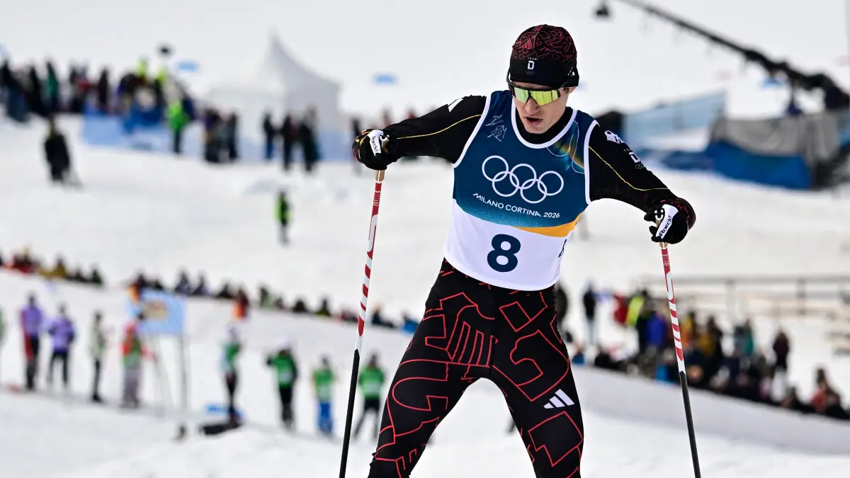 Germany's Vinzenz Geiger competes in the cross-country of the nordic combined individual Gundersen normal hill/10km event at Tesero Cross Country Stadium at Lago di Tesero (Val di Fiemme) during the Milano Cortina 2026 Winter Olympic Games on February 11, 2026. (Photo by Tobias SCHWARZ / AFP)