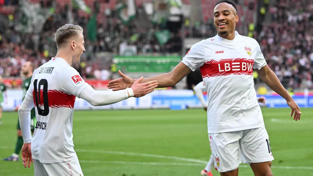 Stuttgart's German forward #18 Jamie Leweling celebrates with Stuttgart's German midfielder #10 Chris Fuehrich after scoring his team's second goal during the German first division Bundesliga football match between VfB Stuttgart and VfL Wolfsburg in Stuttgart, southern Germany, on March 1, 2026. (Photo by THOMAS KIENZLE / AFP) / DFL REGULATIONS PROHIBIT ANY USE OF PHOTOGRAPHS AS IMAGE SEQUENCES AND/OR QUASI-VIDEO