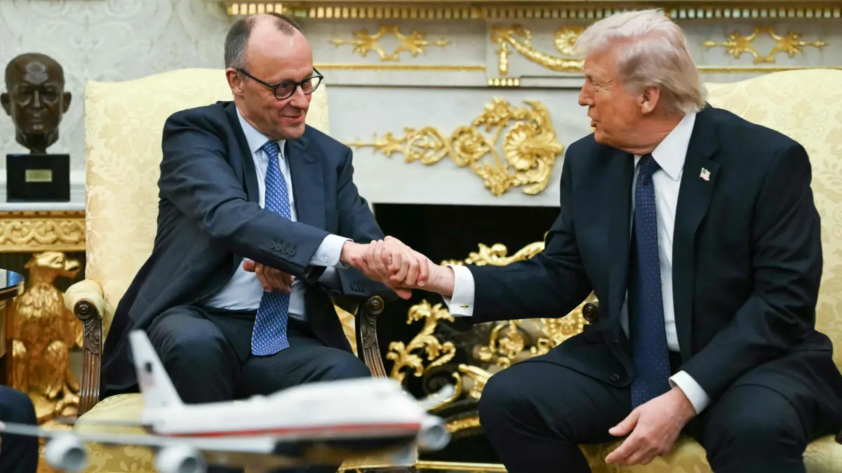 German Chancellor Merz visits: US President Donald Trump shakes hands with German Chancellor Friedrich Merz as they meet in the Oval Office of the White House in Washington, DC on March 3, 2026. Chancellor Merz is the first European leader to visit President Trump since the United States and Israel launched their war against Iran. (Photo by ANDREW CABALLERO-REYNOLDS / AFP)