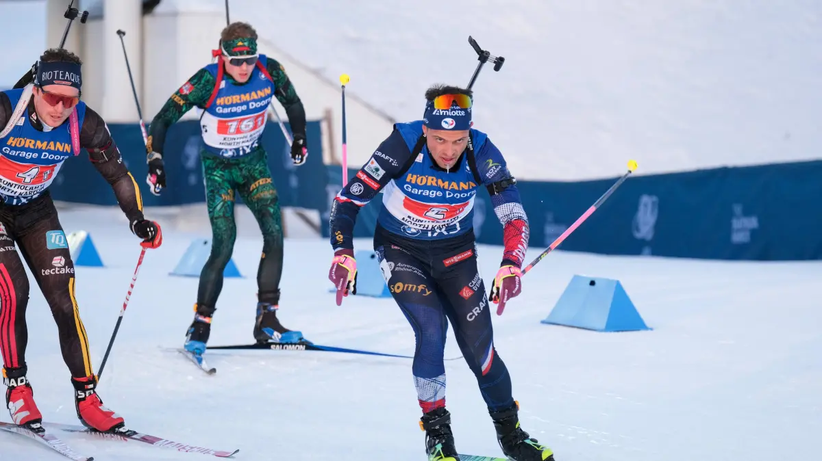 France's Fabien Claude (R) competes competes during the men's 4x7,5km relay event of the IBU Biathlon World Cup in Kontiolahti, Finland, on March 7, 2026. Norway won the race ahead of France (2nd) and Sweden (3rd). (Photo by Minna Raitavuo / Lehtikuva / AFP)