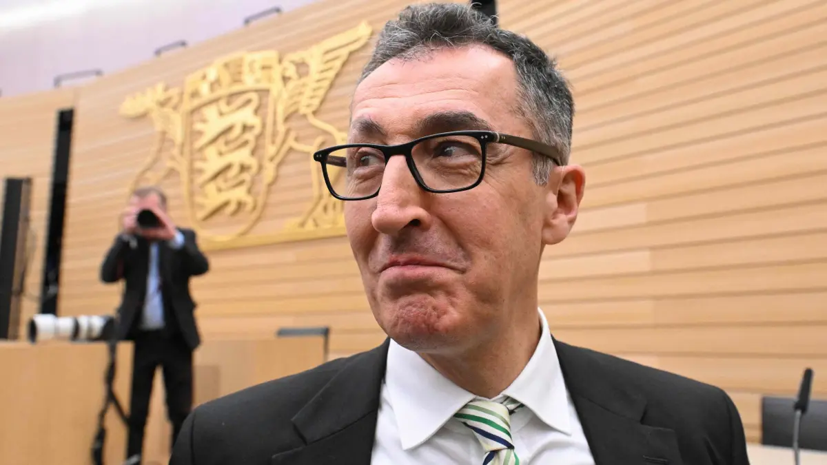 Cem Ozdemir, top candidate of the Greens poses at the state parliament in Baden-Wuerttemberg ahead of a press conference after exit polls were announced in the state elections on March 8, 2026 in Stuttgart, southern Germany. The German Greens have beaten Chancellor Friedrich Merz's conservative CDU in a state election seen as a test for the German leader, according to exit polls. (Photo by THOMAS KIENZLE / AFP)