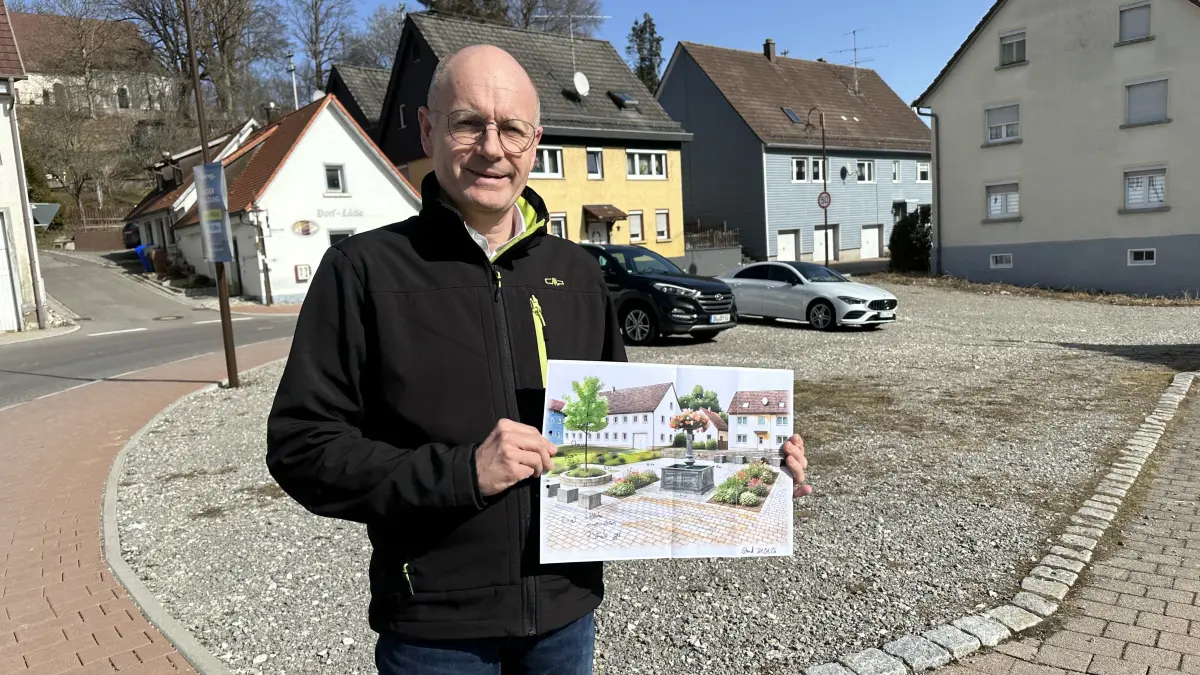 Bürgermeister Stefan Weiskopf hält den Entwurf in Händen: So könnte es bald schon in Hausens Dorfmitte aussehen.