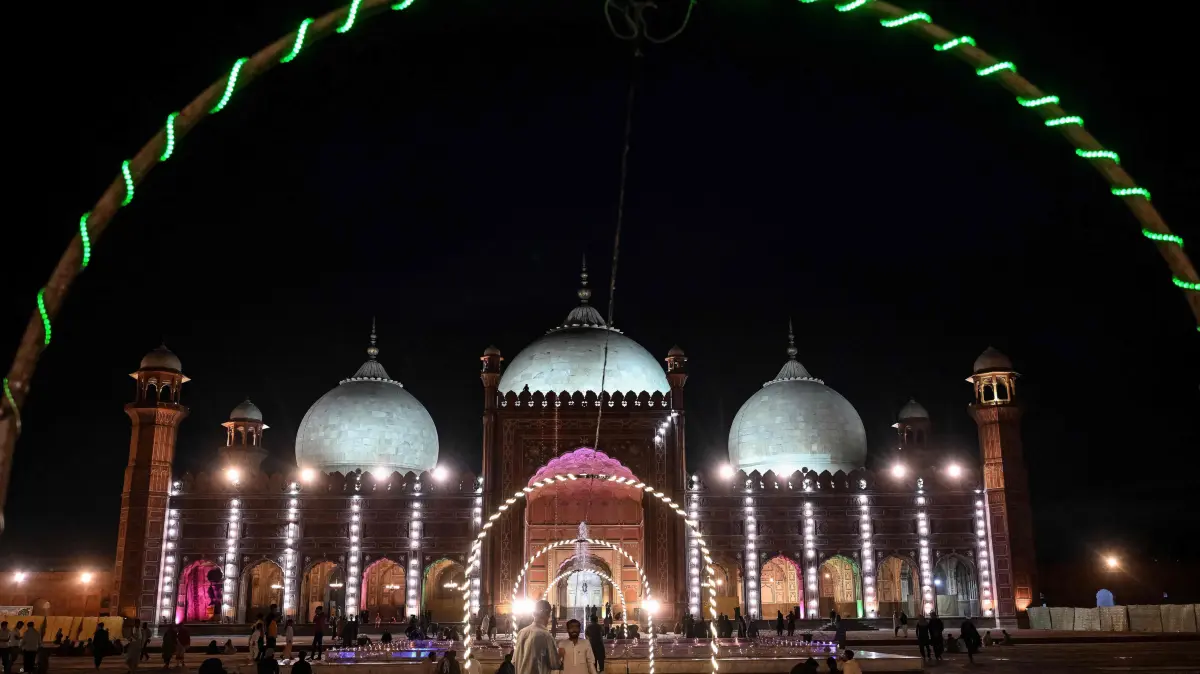 Muslim devotees gather to pray during the Islamic holy fasting month of Ramadan at Badshahi Mosque in Lahore on March 16, 2026. (Photo by Arif ALI / AFP)