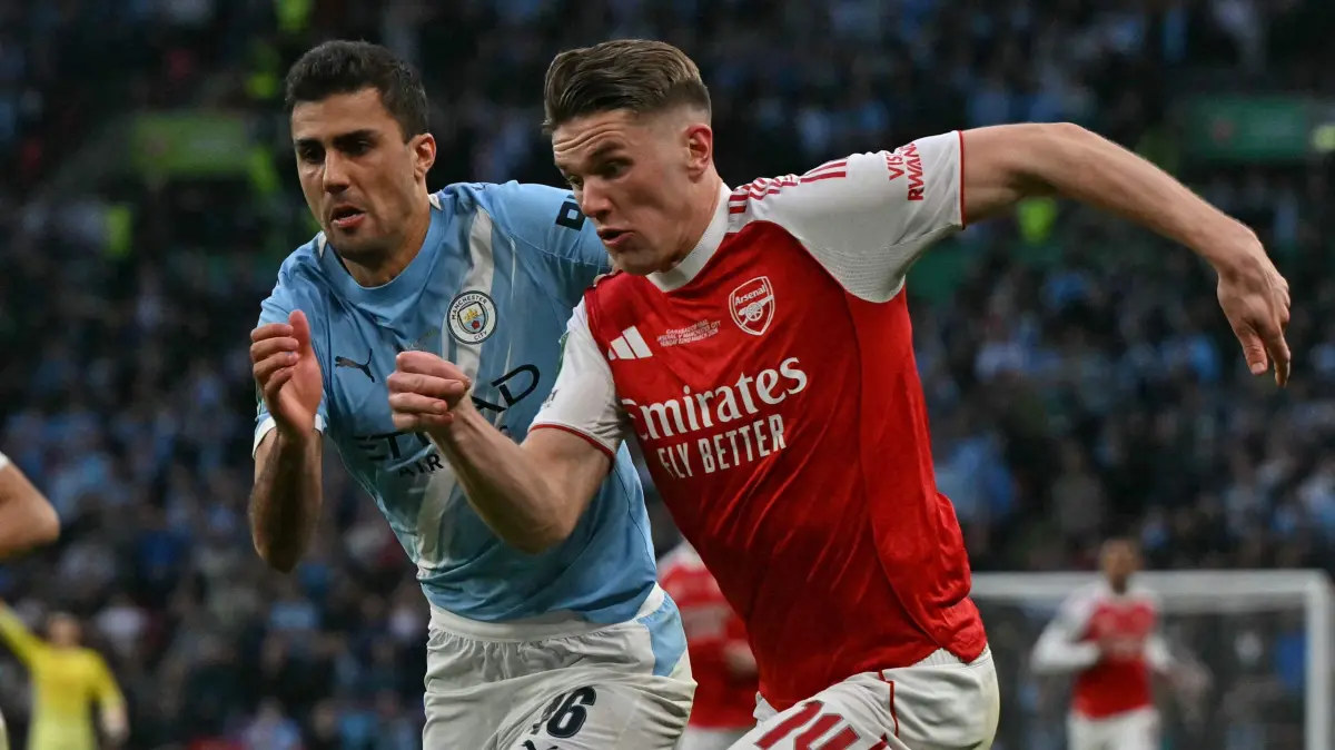776469756: Arsenal's Swedish striker #14 Viktor Gyokeres (R) vies with Manchester City's Spanish midfielder #16 Rodri (C) during the English League Cup final football match between Arsenal and Manchester City at Wembley Stadium in London on March 22, 2026. (Photo by Glyn KIRK / AFP) / RESTRICTED TO EDITORIAL USE. No use with unauthorized audio, video, data, fixture lists, club/league logos or 'live' services. Online in-match use limited to 120 images. An additional 40 images may be used in extra time. No video emulation. Social media in-match use limited to 120 images. An additional 40 images may be used in extra time. No use in betting publications, games or single club/league/player publications. /