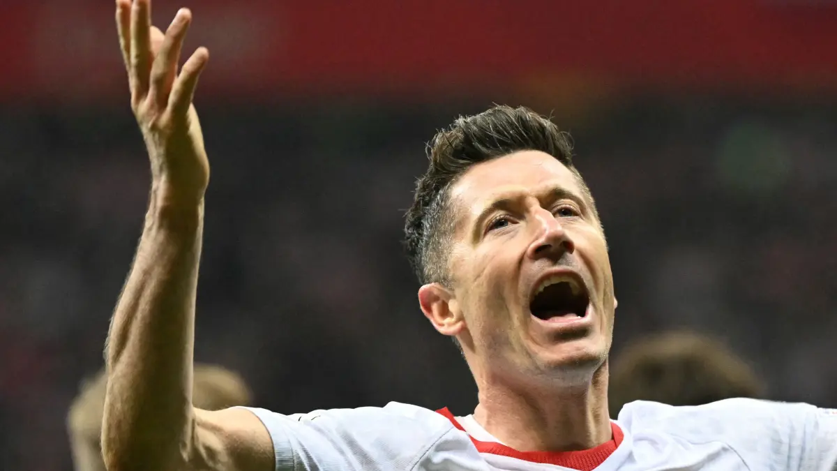 Poland's forward #09 Robert Lewandowski celebrates scoring his team's first goal during the play-off FIFA World Cup 2026 European qualification semi-final football match between Poland and Albania in Warsaw on March 26, 2026. (Photo by Sergei GAPON / AFP)