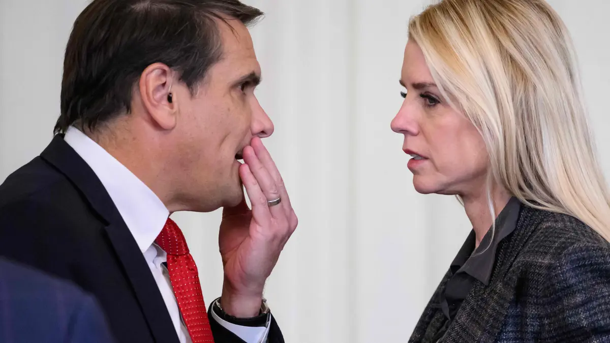(FILES) US Attorney General Pam Bondi (R) speaks with the Deputy Attorney General Todd Blanche following a ceremony with President Donald Trump and the Florida Panthers of the National Hockey League, winners of the 2025 Stanley Cup, in the East Room of the White House in Washington, DC on January 15, 2026. US media reported on April 2, 2026, that US President Donald Trump has fired Attorney General Pam Bondi. CNN and other US outlets said Deputy Attorney General Todd Blanche, Trump's former personal lawyer, would serve as acting attorney general. (Photo by MANDEL NGAN / AFP)
