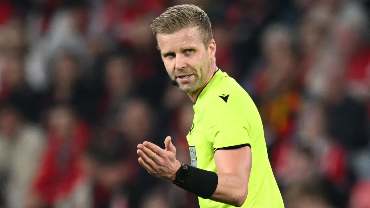 Swedish referee Glenn Nyberg gestures during the UEFA Europa League Quarter final First Leg football match between SC Freiburg and Celta Vigo in Freiburg, on April 9, 2026. (Photo by Silas STEIN / AFP)