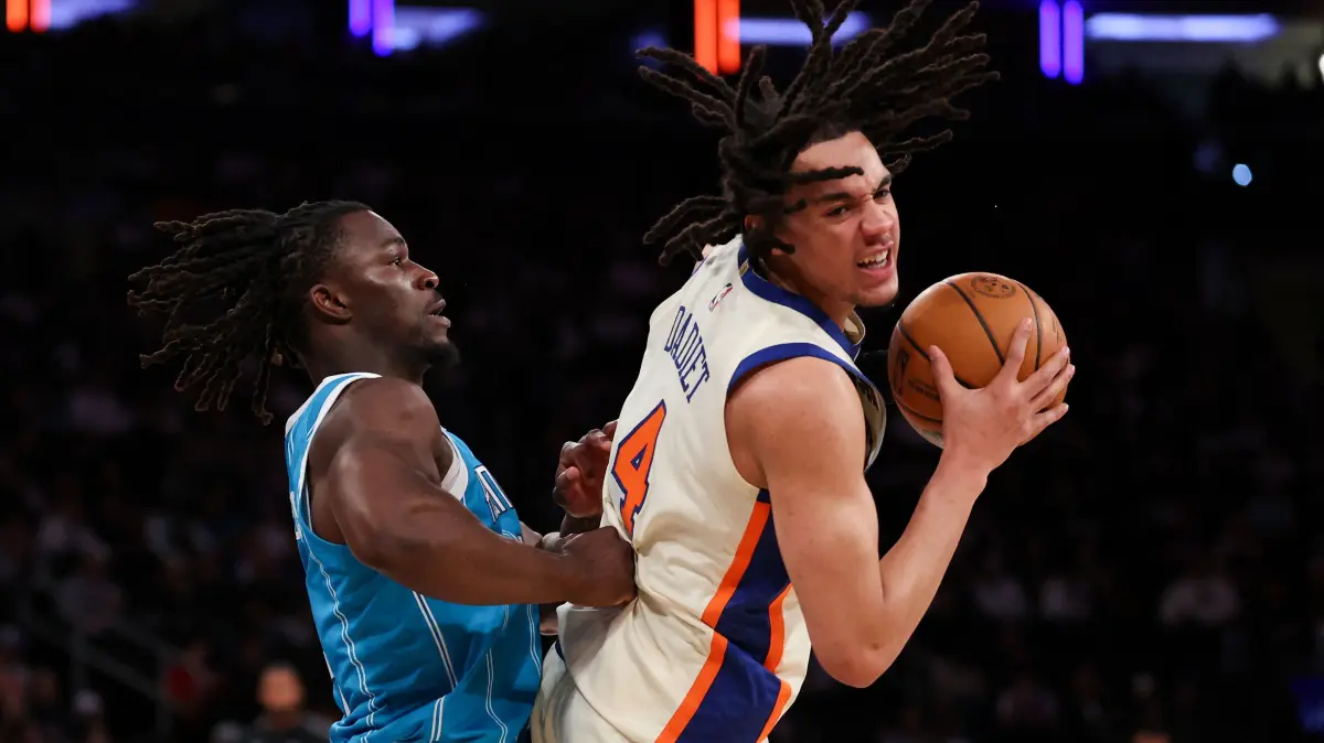 Charlotte Hornets v New York Knicks: NEW YORK, NEW YORK - APRIL 12: Pacome Dadiet #4 of the New York Knicks controls the ball while defended by Sion James #4 of the Charlotte Hornets during the second half at Madison Square Garden on April 12, 2026 in New York City. NOTE TO USER: User expressly acknowledges and agrees that, by downloading and or using this photograph, User is consenting to the terms and conditions of the Getty Images License Agreement. Jordan Bank/Getty Images/AFP (Photo by Jordan Bank / GETTY IMAGES NORTH AMERICA / Getty Images via AFP)
