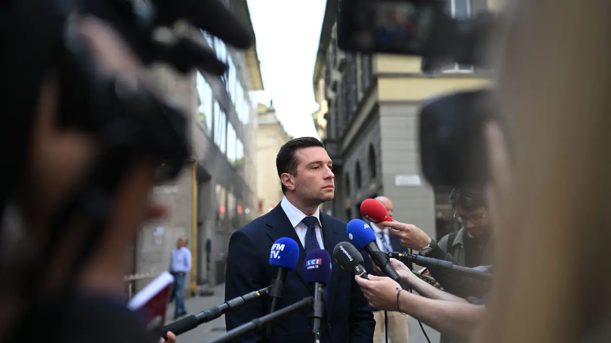 France’s far-right Rassemblement National (RN) party President Jordan Bardella speaks to the press on the sidelines of a rally organized by the Patriots for Europe group (PfE) at the European Parliament and titled “Without Fear: in Europe, masters in our own home,” in Milan on April 18, 2026. (Photo by PIERO CRUCIATTI / AFP)