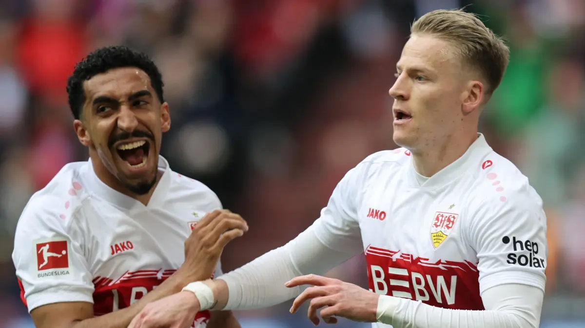 Football: Bundesliga - day 30: Bayern Munich v VfB Stuttgart: Stuttgart's German midfielder #10 Chris Fuehrich celebrates scoring his team's first goal 0:1 with Stuttgart's Portuguese forward #08 Tiago Tomas during the German first division Bundesliga football match between FC Bayern Munich and VfB Stuttgart in Munich, southern Germany, on April 19, 2026. (Photo by Alexandra BEIER / AFP) / DFL REGULATIONS PROHIBIT ANY USE OF PHOTOGRAPHS AS IMAGE SEQUENCES AND/OR QUASI-VIDEO