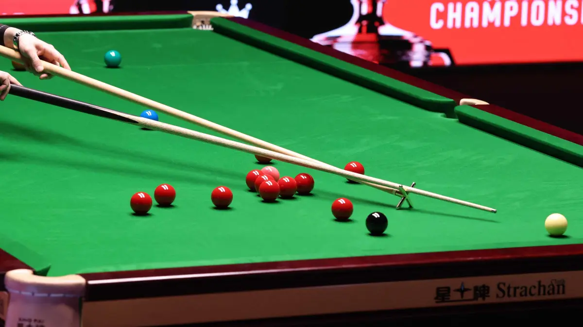 776479936: Iran's Hossein Vafaei plays a shot against China's Si Jiahui during the World Snooker Championship Round One match at The Crucible in Sheffield, northern England on April 22, 2026. The World Snooker Championship 2025 will take place from April 19 to May 5, 2025. (Photo by Darren Staples / AFP)