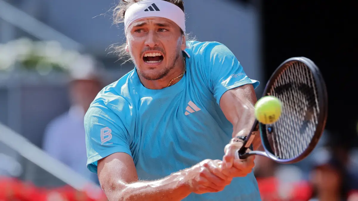 Germany’s Alexander Zverev returns the ball to Argentina’s Mariano Navone during their 2026 ATP Tour Madrid Open tennis tournament third round singles match at the Caja Magica in Madrid, on April 25, 2026. (Photo by Thomas COEX / AFP)