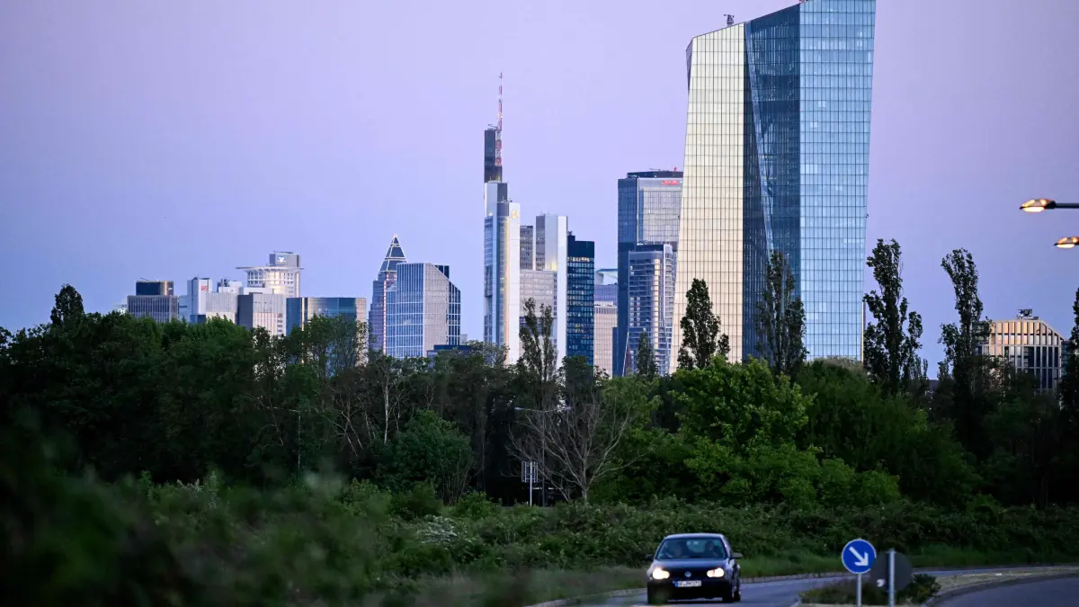 A car drives near the European Central Bank (ECB) headquarters (R) and other high-rise buildings in the banking district in Frankfurt am Main, western Germany, on April 29, 2026, one day before the meeting on the Eurozone's monetary policy. Inflation expectations are closely watched by the ECB, which is mulling whether it needs to hike interest rates if consumer prices rise faster due to the US-Israeli war against Iran.
The ECB holds its next meeting on Thursday, April 30, and although it is expected to hold rates steady again for now as it waits for the impact of the conflict to become clearer, there will be sharp focus on President Lagarde's press conference for whatever clues she gives about the bank's outlook. (Photo by Kirill KUDRYAVTSEV / AFP)