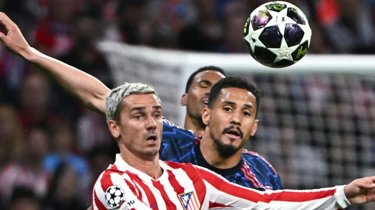 Arsenal's Brazilian defender #06 Gabriel Magalhaes challenges Atletico Madrid's French forward #07 Antoine Griezmann during the UEFA Champions League semi-final first leg football match between Club Atletico de Madrid and Arsenal at the Metropolitano stadium in Madrid on April 29, 2026. (Photo by Javier SORIANO / AFP)