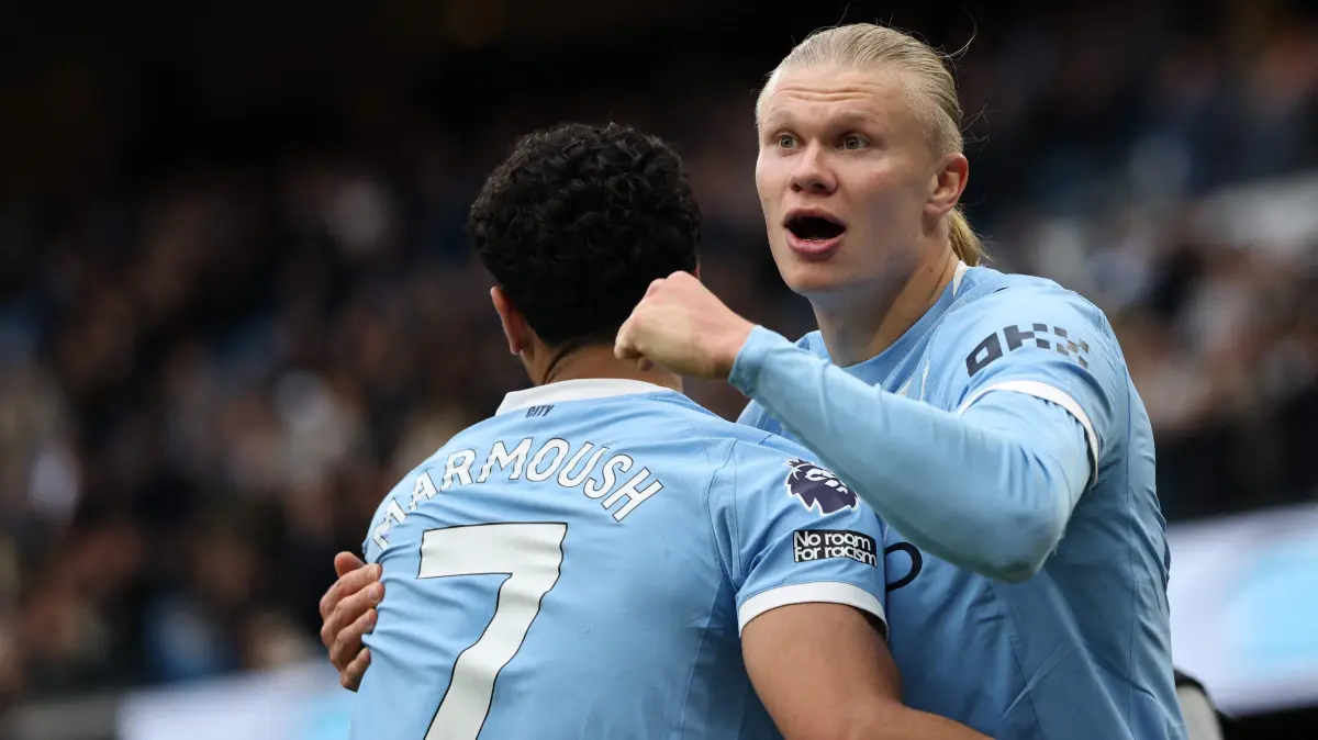 Manchester City's Norwegian striker #09 Erling Haaland (R) celebrates with Manchester City's Egyptian striker #07 Omar Marmoush (L) after scoring their second goal during the English Premier League football match between Manchester City and Brentford at the Etihad Stadium in Manchester, north west England, on May 9, 2026. (Photo by Darren Staples / AFP) / RESTRICTED TO EDITORIAL USE. No use with unauthorized audio, video, data, fixture lists, club/league logos or 'live' services. Online in-match use limited to 120 images. An additional 40 images may be used in extra time. No video emulation. Social media in-match use limited to 120 images. An additional 40 images may be used in extra time. No use in betting publications, games or single club/league/player publications. /