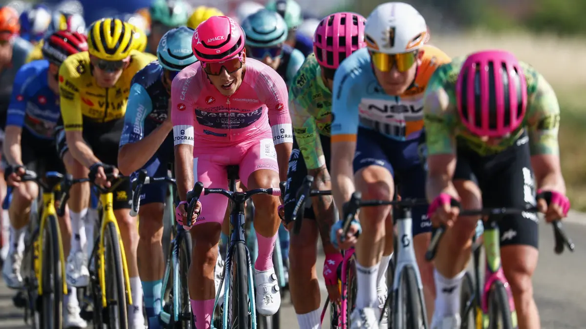 Bahrain - Victorious Portuguese rider Afonso Eulalio wearing the overall leader's pink jersey cycles during the 12th stage of the Giro d'Italia 2026 - Tour of Italy cycling race between Imperia and Novi Ligure, Italy, on May 21, 2026. (Photo by Luca Bettini / AFP)