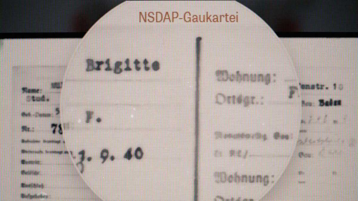 This photo taken on June 2, 2026 shows an online database published by Die Zeit, a German national weekly newspaper, with the National Socialist German Workers’ party (NSDAP) membership card of German lecturer Felix Puelm’s grandmother Brigitte, at Silpakorn University, in Nakhon Pathom province, west of Bangkok. (Photo by ANTHONY WALLACE / AFP)