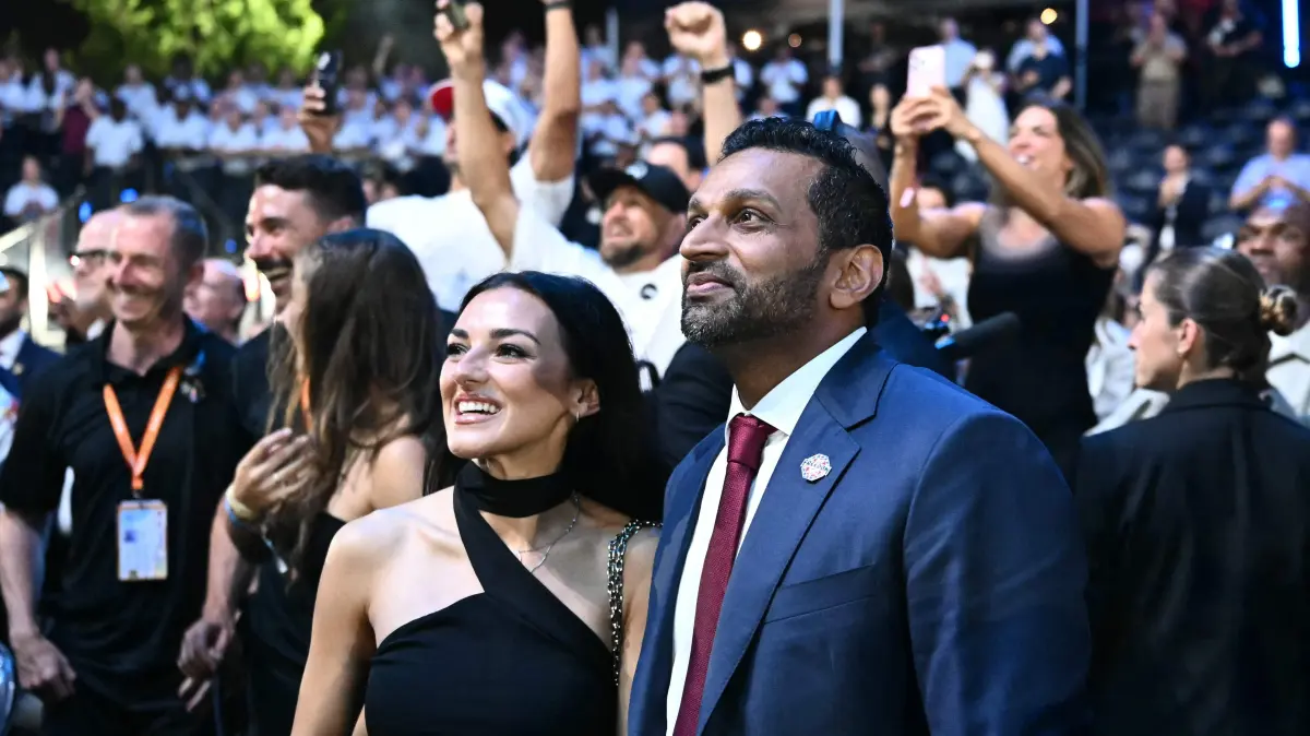 776510421: FBI Director Kash Patel stands with singer Alexis Wilkins at the conclusion of the "UFC Freedom 250" mixed martial arts event on the South Lawn of the White House in Washington, DC, in the early morning hours of June 15, 2026. (Photo by Kent NISHIMURA / AFP)