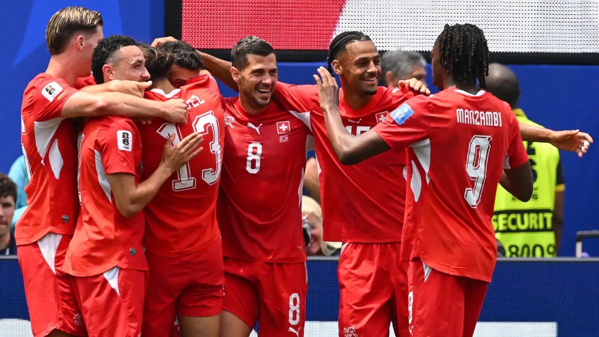 FBL-WC-2026-MATCH26-SUI-BIH: Switzerland's midfielder #10 Granit Xhaka celebrates scoring his team's fourth goal with teammates during the 2026 World Cup Group B football match between Switzerland and Bosnia and Herzegovina at Los Angeles Stadium in Inglewood on June 18, 2026. (Photo by Patrick T. Fallon / AFP)