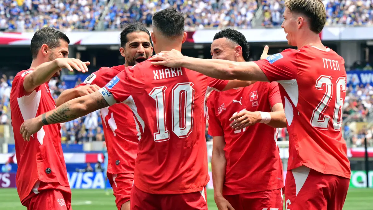 FBL-WC-2026-MATCH26-SUI-BIH: Switzerland's midfielder #10 Granit Xhaka celebrates scoring his team's fourth goal with teammates during the 2026 World Cup Group B football match between Switzerland and Bosnia and Herzegovina at Los Angeles Stadium in Inglewood on June 18, 2026. (Photo by Frederic J. Brown / AFP)