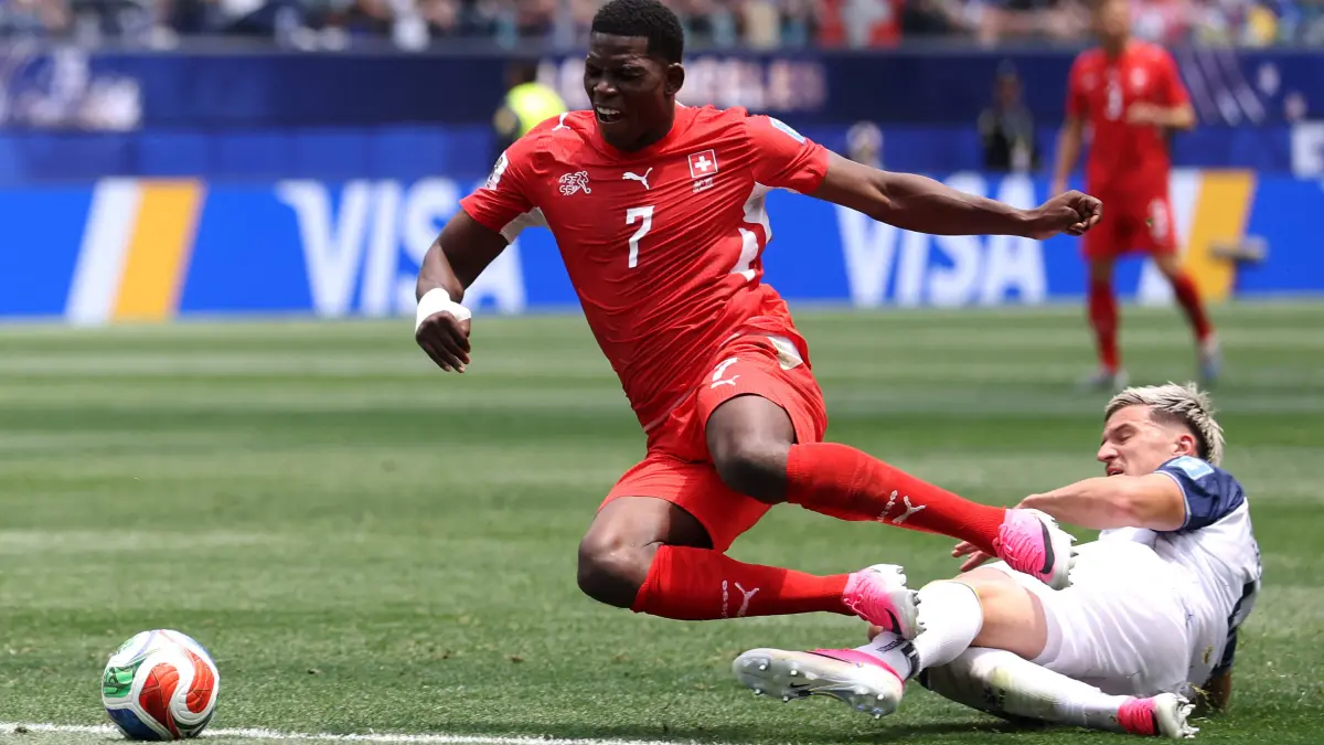 Switzerland v Bosnia and Herzegovina: Group B - FIFA World Cup 2026: INGLEWOOD, CALIFORNIA - JUNE 18: Tarik Muharemovic #4 of Bosnia and Herzegovina tackles and fouls Breel Embolo of Switzerland receiving a red card during the FIFA World Cup 2026 Group B match between Switzerland and Bosnia and Herzegovina at Los Angeles Stadium on June 18, 2026 in Inglewood, California. Dean Mouhtaropoulos/Getty Images/AFP (Photo by Dean Mouhtaropoulos / GETTY IMAGES NORTH AMERICA / Getty Images via AFP)
