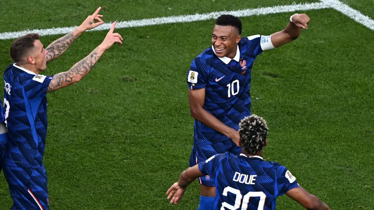 FBL-WC-2026-MATCH89-PAR-FRA: France's forward #10 Kylian Mbappe and teammates defender #03 Lucas Digne and forward #20 Desire Doue celebrate after winning the 2026 World Cup round of 16 football match between Paraguay and France at the Philadelphia Stadium in Philadelphia on July 4, 2026. (Photo by Jewel SAMAD / AFP)