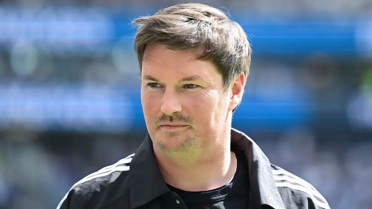 Merlin Polzin: ARCHIV - 02.05.2026, Hessen, Frankfurt/M.: Fußball, Männer: Bundesliga, Eintracht Frankfurt - Hamburger SV, 32. Spieltag, Deutsche Bank Park. Trainer Merlin Polzin (Hamburger SV) vor dem Spiel. HSV-Trainer Merlin Polzin ist von einer positiven Zusammenarbeit mit der künftigen Sportvorständin Kathleen Krüger überzeugt. (zu dpa: «HSV-Start: Kader noch lange nicht komplett») Foto: Florian Wiegand/dpa +++ dpa-Bildfunk +++