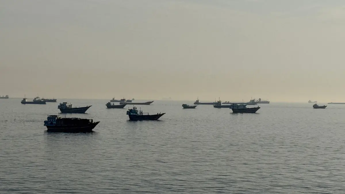 FILES-OMAN-IRAN-US-ISRAEL-WAR: (FILES) Vessels are seen anchored in the Strait of Hormuz, off the port city of Khasab on Oman’s northern Musandam Peninsula on May 17, 2026. Tehran announced it was closing the Strait of Hormuz on July 12 and launched missiles and drones at its Gulf neighbours, in retaliation for new US strikes following an attack by Iranian forces on a merchant vessel that was abandoned in flames by its crew. (Photo by AFP) /