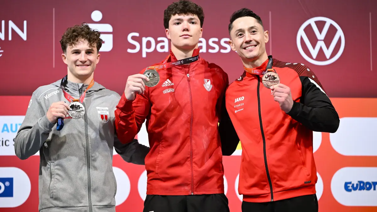 DIE FINALS 2026 - Deutsche Meisterschaften Geraeteturnen Mehrkampf Maenner, 23.07.2026 : Siegerehrung - Radomyr Stelmakh SC Cottbus Turnen gewinnt vor Alexander Kunz TSV Pfuhl und Andreas Toba Turn-Klubb zu Hannover 1858 DIE FINALS 2026 - Deutsche Meisterschaften Geraeteturnen Mehrkampf Maenner, 23.07.2026 DIE FINALS 2026 - Deutsche Meisterschaften Geraeteturnen Mehrkampf Maenner, 23.07.2026 Hannover *** Awards Ceremony: Radomyr Stelmakh SC Cottbus Turnen wins ahead of Alexander Kunz TSV Pfuhl and Andreas Toba Turn Klubb zu Hannover 1858 at THE FINALS 2026 German Artistic Gymnastics All-Around Championships for Men, July 23, 2026 THE FINALS 2026 German Artistic Gymnastics Championships Mens All-Around, July 23, 2026 Hanover Copyright: xEibner-Pressefoto/xHoepnerx EP_PHR