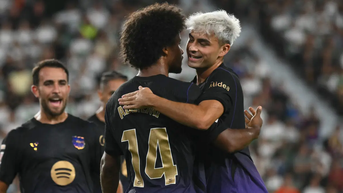 : Barcelona's German forward #14 Karim Adeyemi celebrates with Barcelona's Spanish midfielder #08 Pedri scoring his team's second goal during the Spanish league football match between Elche CF and FC Barcelona at Martinez Valero Stadium in Elche on August 23, 2026. (Photo by JOSE JORDAN / AFP)