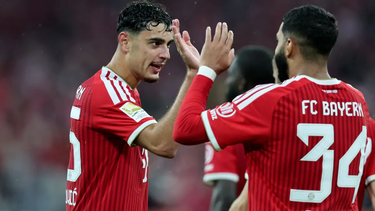 FBL-GER-BUNDESLIGA-BAYERN MUNICH-STUTTGART: Bayern Munich's German midfielder #45 Aleksandar Pavlovic celebrates scoring his team's fourth goal with Bayern Munich's Moroccan midfielder #34 Ismael Saibari during the German first division Bundesliga football match between FC Bayern Munich and VfB Stuttgart in Munich, southern Germany, on August 28, 2026. (Photo by Alexandra BEIER / AFP) / DFL REGULATIONS PROHIBIT ANY USE OF PHOTOGRAPHS AS IMAGE SEQUENCES AND/OR QUASI-VIDEO