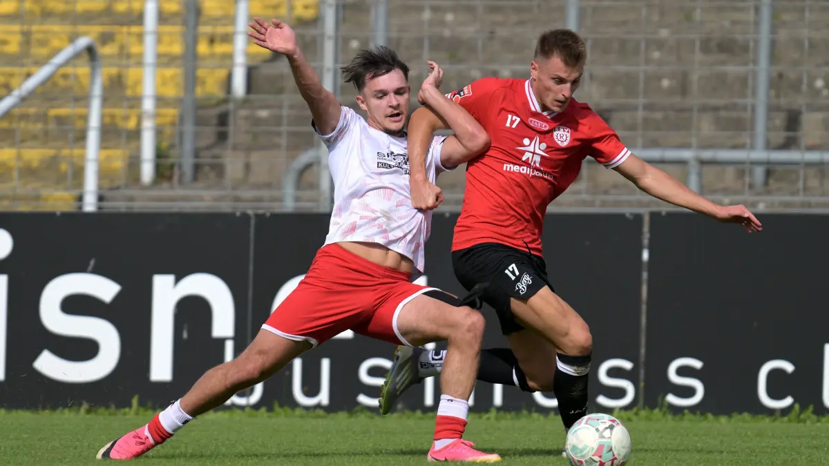 Fussball OL | SSV Reutlingen vs. 1. FC Normannia Gmuend: Fussball OL | SSV Reutlingen (rot) vs. 1. FC Normannia Gmuend (weiss) // 2026-08-29 // Foto: JoBaur // #33 Daniel Rapp (1. FC Norm. Gmuend) / #17 Tim Schwaiger (SSV Reutlingen)
