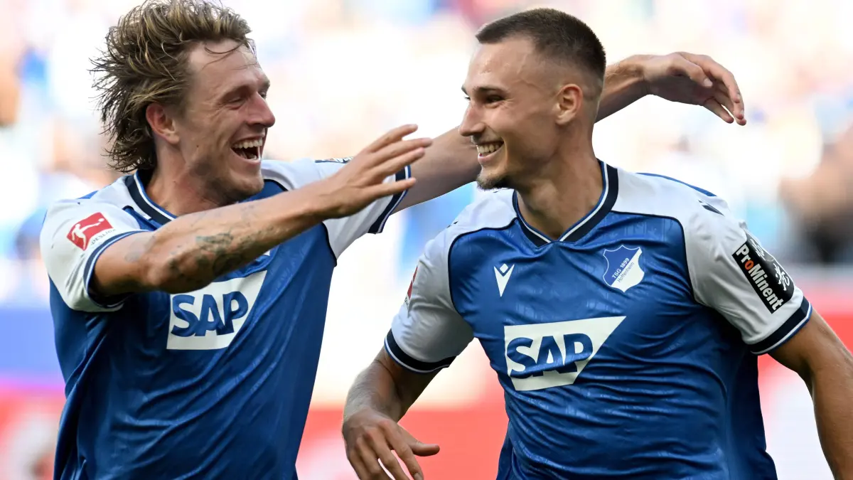 FBL-GER-BUNDESLIGA-HOFFENHEIM-DORTMUND: Hoffenheim's German forward #19 Tim Lemperle (R) celebrates with Hoffenheim's Dutch midfielder #18 Wouter Burger after scoring the 2-0 goal during the German first division Bundesliga football match between TSG Hoffenheim and BVB Borussia Dortmund in Sinsheim, south-western Germany on September 5, 2026. (Photo by THOMAS KIENZLE / AFP) / DFL REGULATIONS PROHIBIT ANY USE OF PHOTOGRAPHS AS IMAGE SEQUENCES AND/OR QUASI-VIDEO