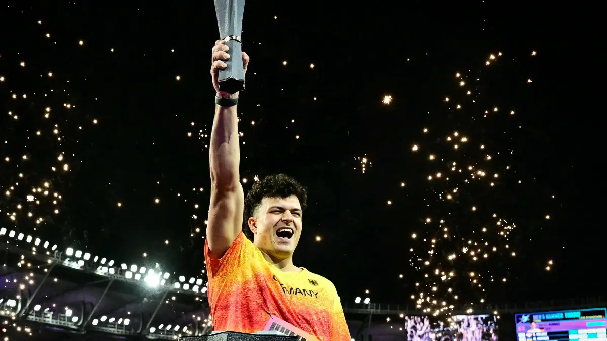 ATHLETICS-WORLD-CHAMPIONSHIP-2026: Winner Germany's Merlin Hummel celebrates with the trophy after his victory in the men's hammer throw final during the World Athletics Ultimate Championship at the Gyula Zsivotzky National Athletics Centre, in Budapest on September 11, 2026. (Photo by Ben STANSALL / AFP)