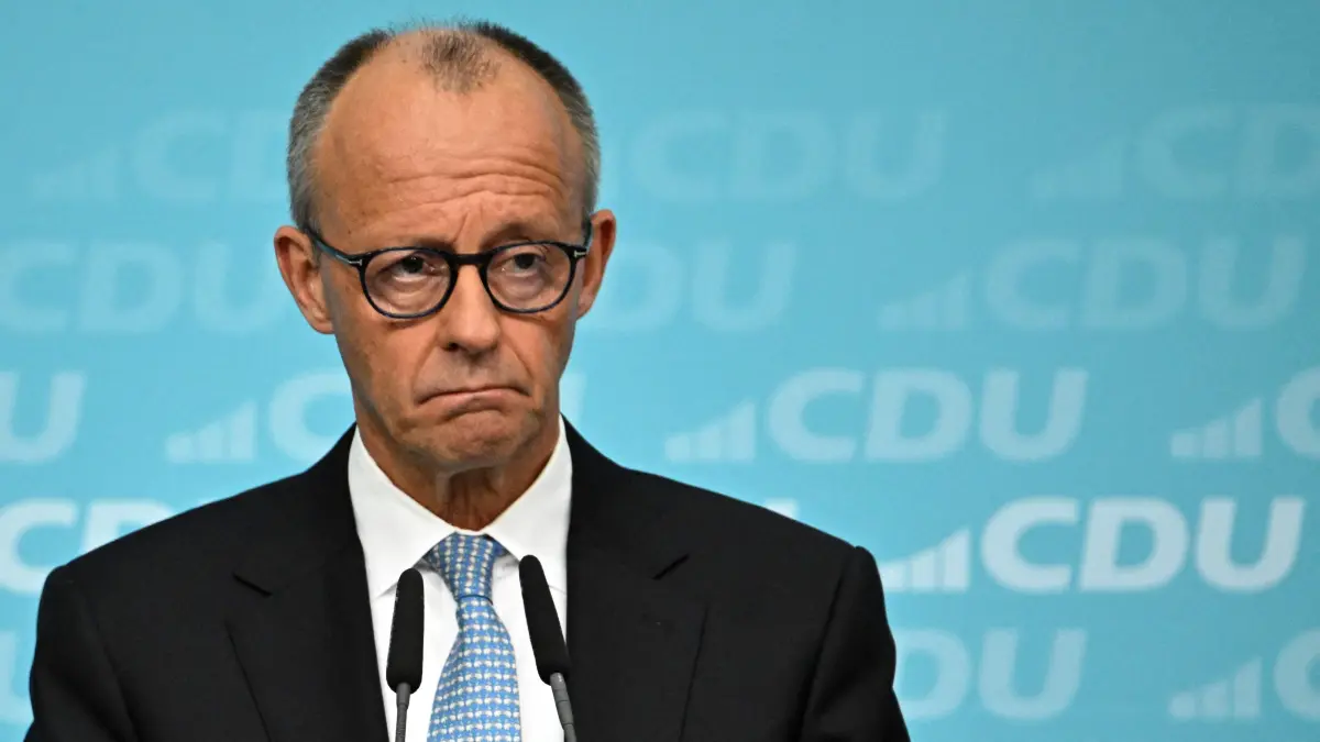 GERMANY-POLITICS-PARTIES-CDU: German Chancellor Friedrich Merz addresses journalists after a meeting with his conservative Christian Democratic Union (CDU) party's leadership on October 12, 2026 in Berlin. (Photo by Tobias SCHWARZ / AFP)