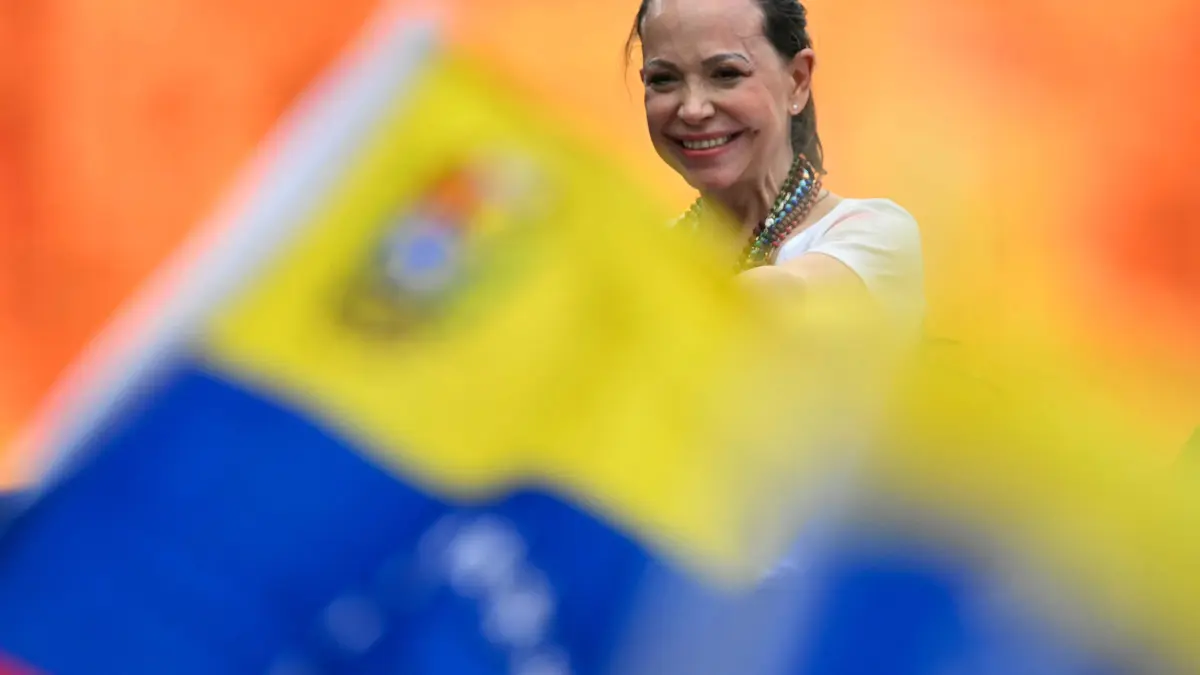 FILES-VENEZUELA-POLITICS-OPPOSITION: (FILES) Venezuelan opposition leader Maria Corina Machado smiles to supporters during a rally with Venezuelan diaspora in Panama City on May 23, 2026. Venezuelan opposition leader Maria Corina Machado said on October 25, 2026, that she had returned to Venezuela. (Photo by MARTIN BERNETTI / AFP)