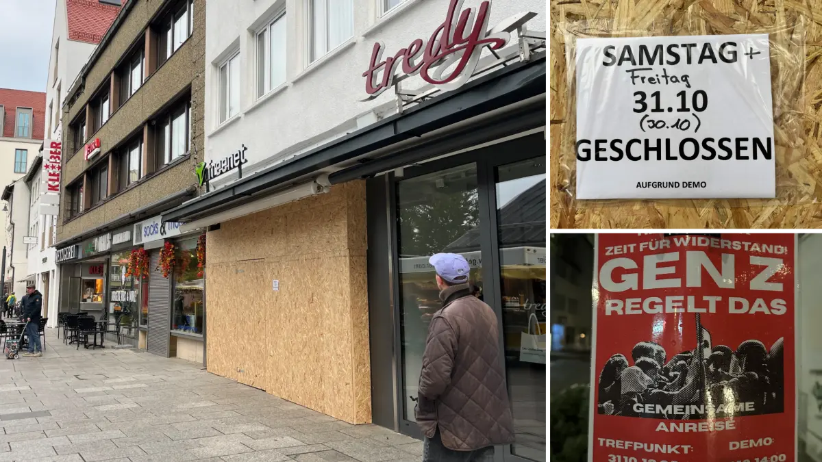 An einem Handy-Geschäft in der Ulmer Innenstadt sind die Schaufenster verbarrikadiert.